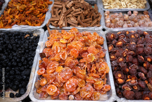 Various dried fruits selling on market stall, The most common varieties are raisins, dates, prunes, figs and apricots. © ltyuan