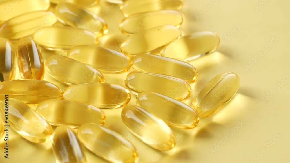 fish oil supplement on orange background fish oil supplement on orange background