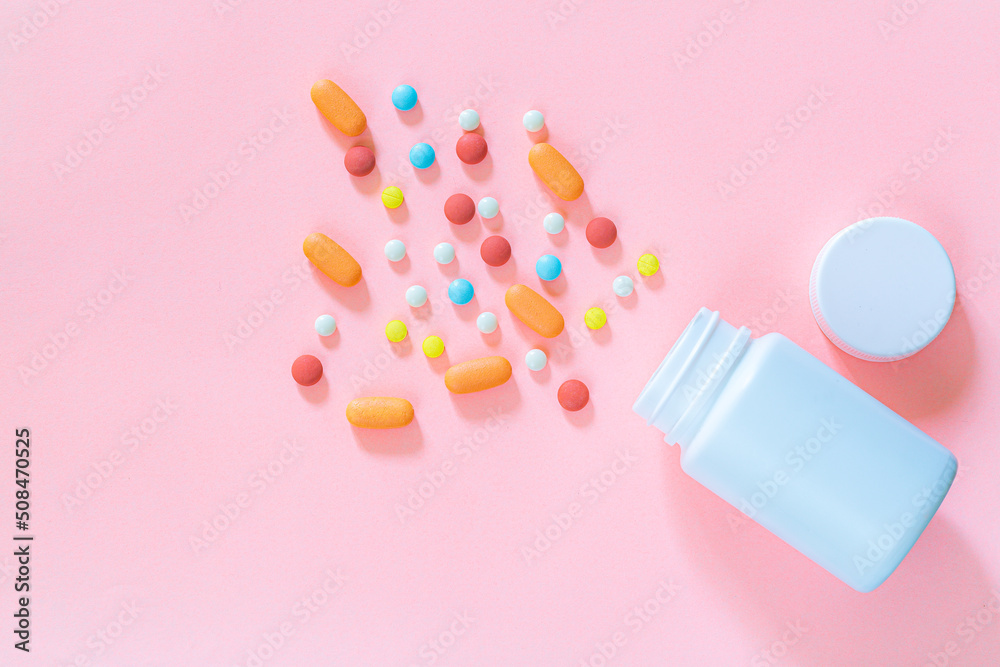 pills and pill bottles on pink background,Assorted pharmaceutical medicine pills, tablets and capsules and bottle on pink background. Top view. Flat lay. Copy space. Medicine concept. Heap of pills on pills and pill bottles on pink background,Assorted pharmaceutical medicine pills, tablets and capsules and bottle on pink background. Top view. Flat lay. Copy space. Medicine concept. Heap of pills on