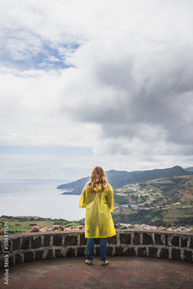 person with an yellow jacket with a view, Azores person with an yellow jacket with a view, Azores