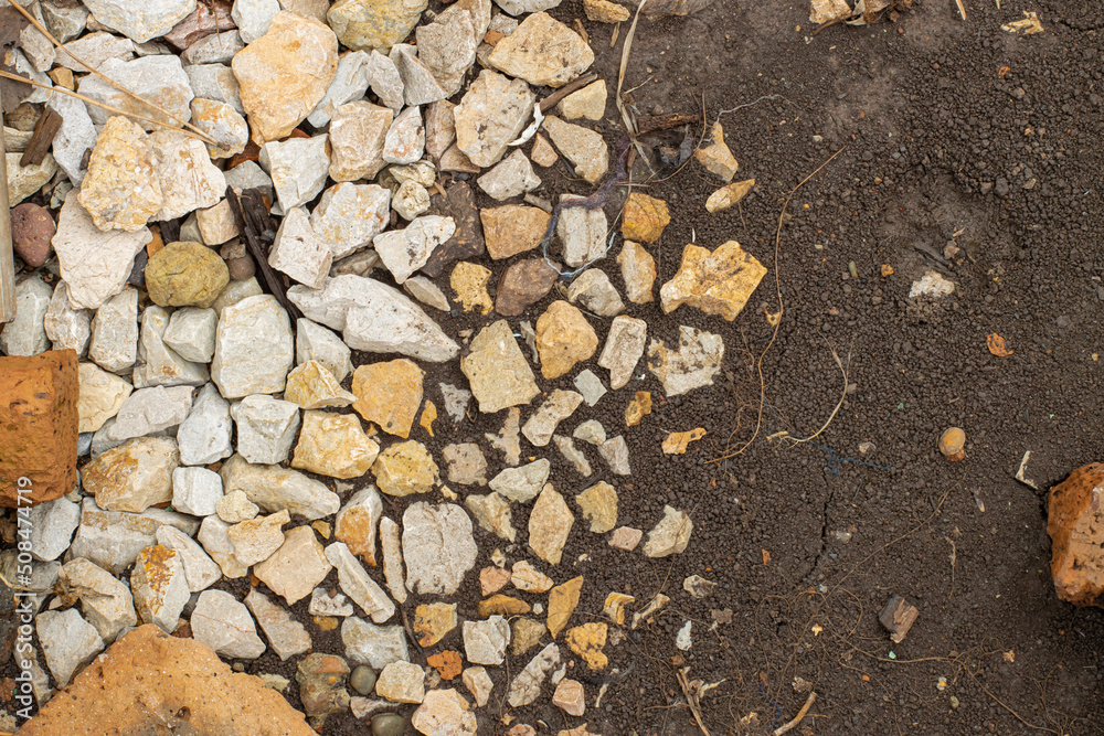 Pattern of stones and soil, top view, space for text Pattern of stones and soil, top view, space for text