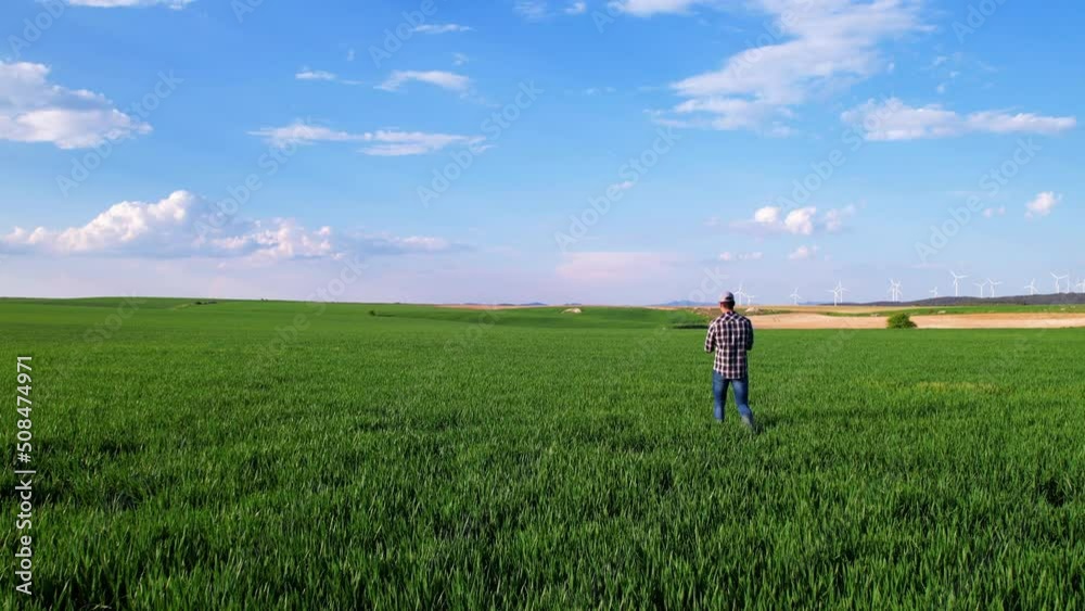 Agronomist walks across the field and works online in a tablet, a farmer makes an analysis of crops on the ground, agricultural life. High quality 4k footage Agronomist walks across the field and works online in a tablet, a farmer makes an analysis of crops on the ground, agricultural life. High quality 4k footage