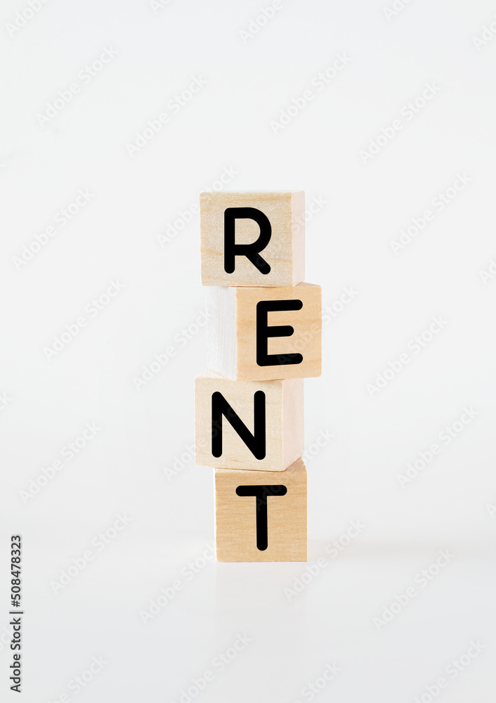 Cubic wooden blocks forming the 'rent' text Cubic wooden blocks forming the 'rent' text