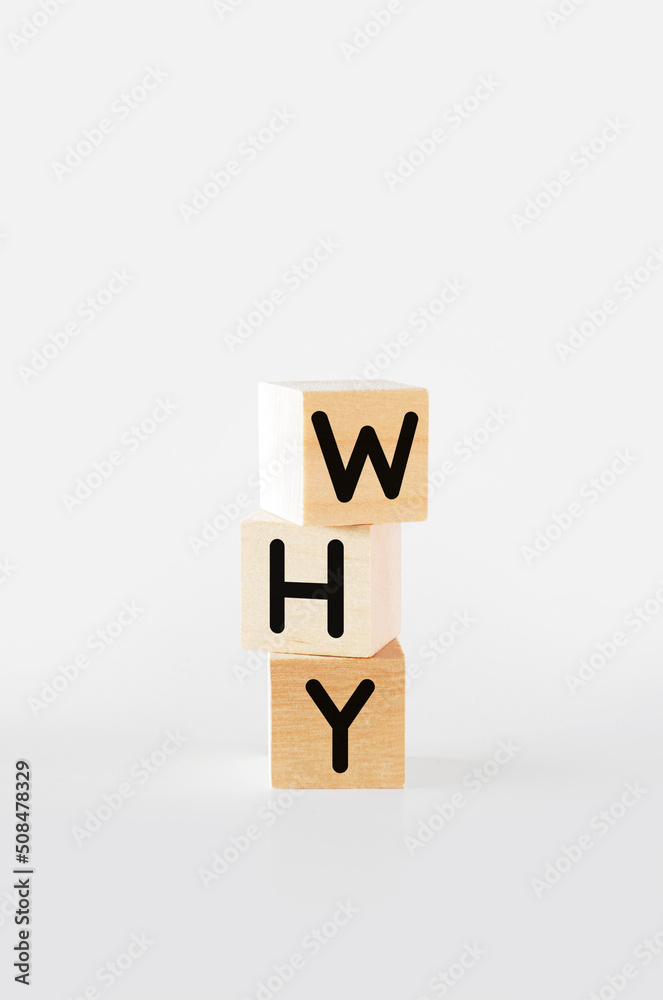 Cubic wooden blocks forming the 'why Cubic wooden blocks forming the 'why