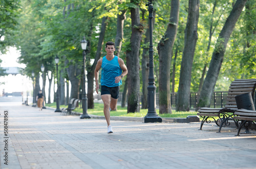 athletic man runner running in sportswear outdoor. sport activity