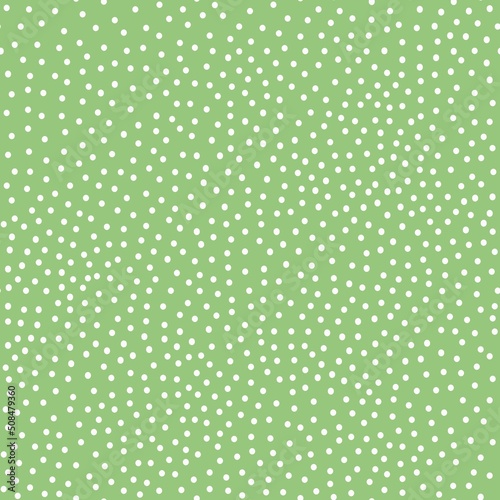 A simple pattern is abstract . small white dots. green background. Fashionable print for textiles, wallpaper and packaging.