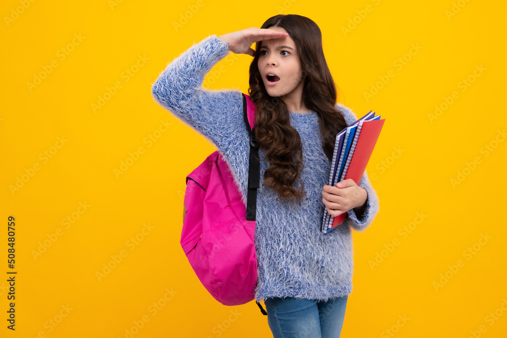 custom made wallpaper toronto digitalSchool girl hold copybook and book on yellow isolated studio background. School and education concept. Teenager girl in school uniform. Shocked amazed face, surprised emotions of young teenager girl.