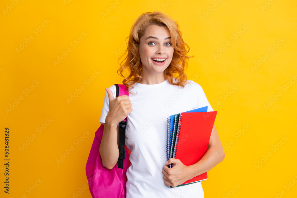 Portrait of smiling young woman student in shirt backpack hold notebooks. Education in high school university college.