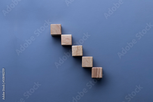 Wooden dice arranged in steps