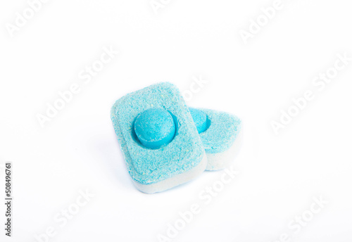 Water softening tablets isolated on white background. Capsules for washing machines and dishwashers, preventing limescale. Place to copy.
