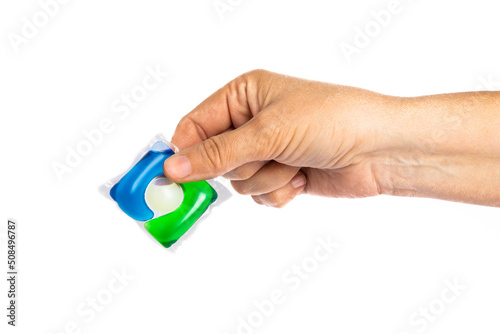 Capsules for washing in hands. washing powders for washing clothes in a washing machine isolated on a white background. The concept of purity. Place for text.