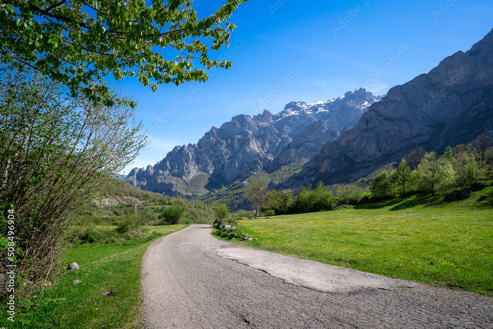 Road to Cain de Valdeón with Picos de Europa mountains in the background. León. spain Road to Cain de Valdeón with Picos de Europa mountains in the background. León. spain