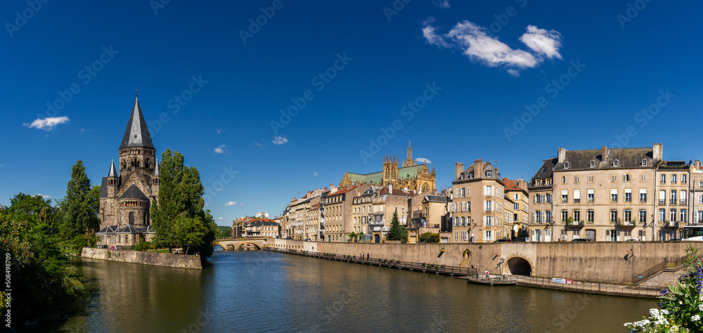 panorama of the Moselle River and Moyen Bridge with the historic city center of Metz behind