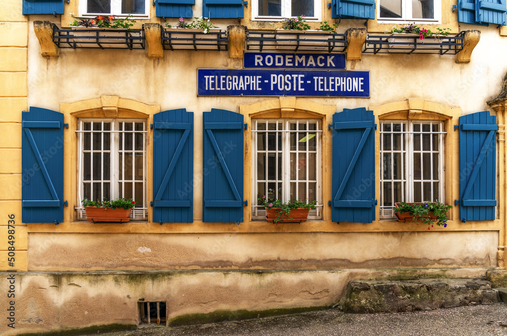 Naklejka premium detail view of the historic post and telegraph office in the village of Rodemack