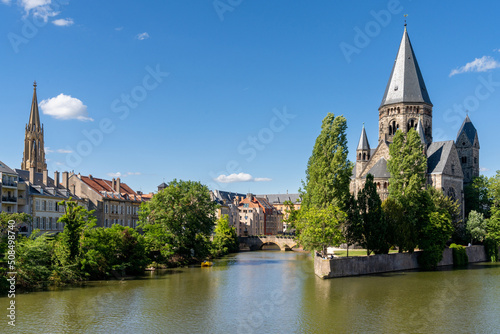 view of the Moselle River and the New Temple in the historic city center of Metz