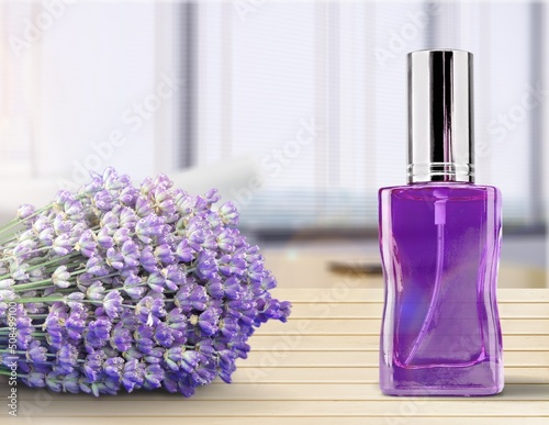 Spray bottle of lavender essential oil. Lavender water, flavored water with Lavender flowers photo