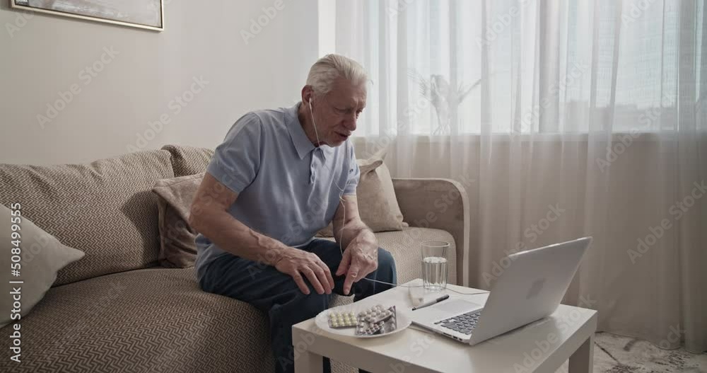 Elderly man making video call to doctor Elderly man making video call to doctor