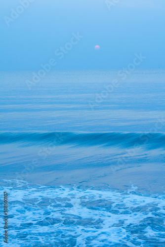Bubbles on golden beach with ocean water in the morning at Thailand beaches.