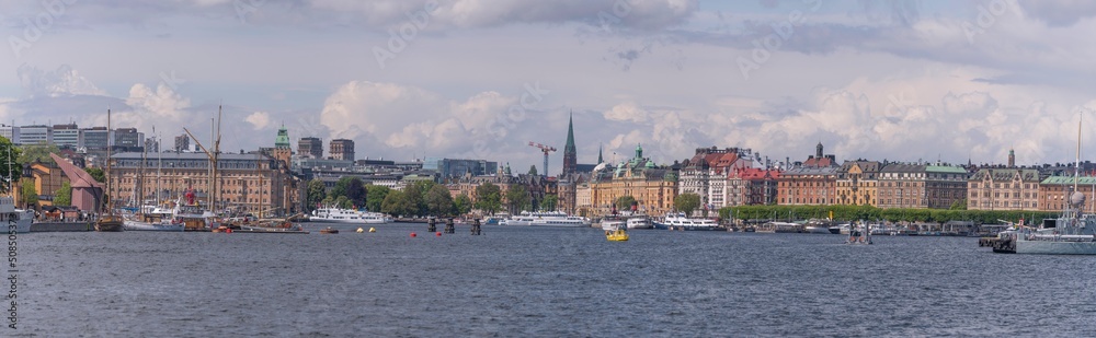 Panorama view with boats, piers, office buildings and hotels in the bay Ladugårdsviken a sunny day in Stockholm