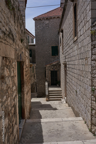 Sibenik  Croatia - May 26  2022 - narrow old street and yard in Sibenik city  medieval zone