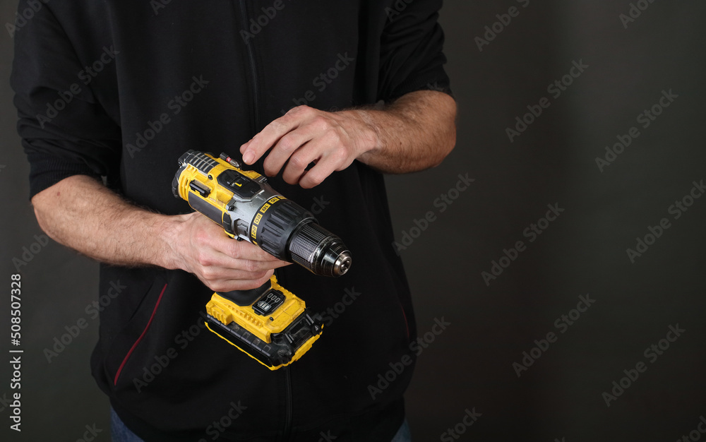 person holding a screwdriver in hands