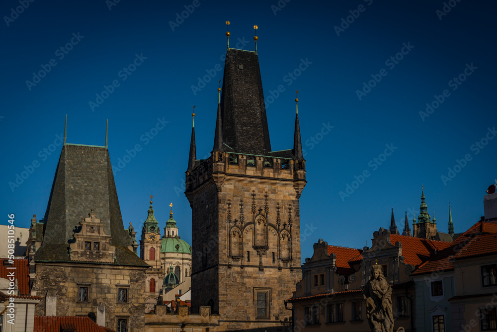 Old Prague houses with towers and old roofs in spring morinig
