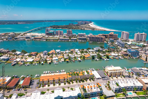 Panorama of Clearwater Beach FL. Florida Beaches. Summer vacations. Beautiful View on Hotels and Resorts on Island. Turquoise color of Ocean water. American Coast or shore Gulf of Mexico. Sunny Day