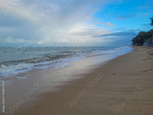 fisherman's beach with clouds and shy sun after rain, Arrial D'Ajuda, Bahia, Brazil