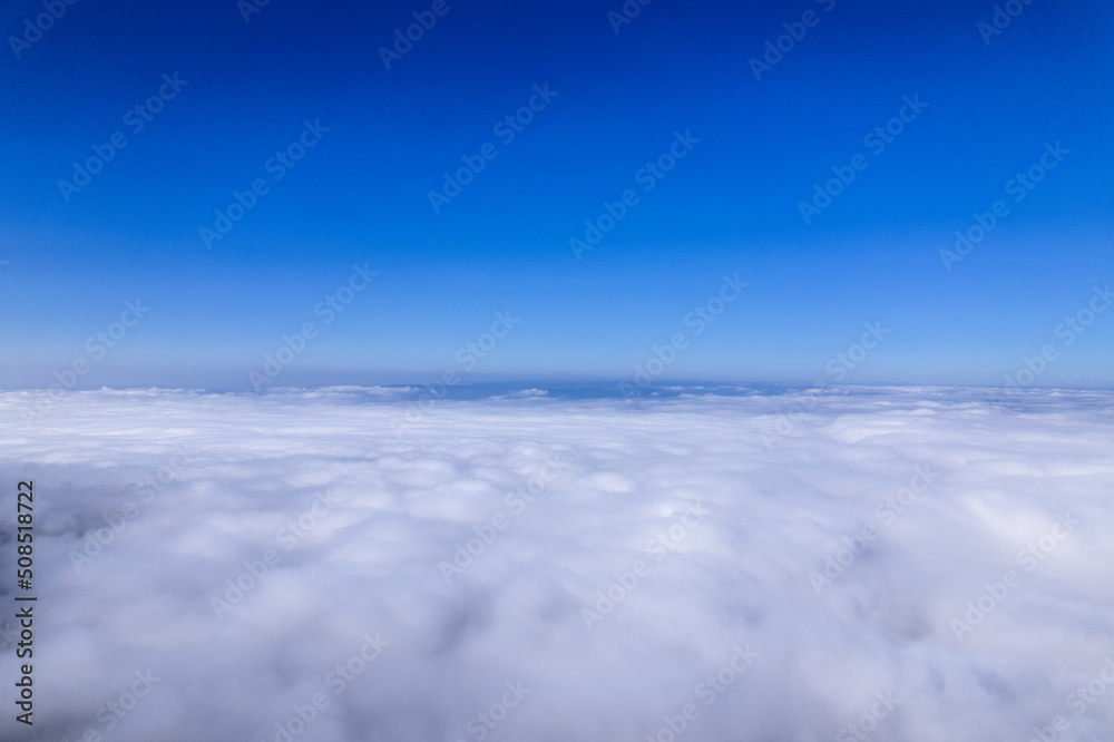 View of the thick clouds and clear blue sky. 
