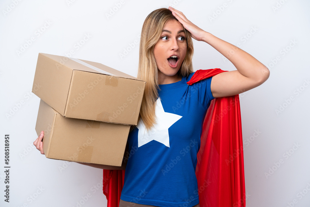 Super Hero delivery woman isolated on white background doing surprise gesture while looking to the side Super Hero delivery woman isolated on white background doing surprise gesture while looking to the side