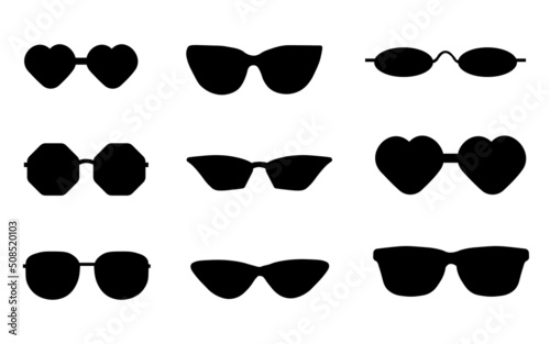Black silhouette of a set of glasses. A set of blue frame sunglasses with black and dark lenses.