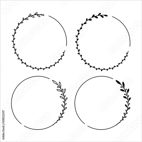 Set of 4 hand drawn spring wreaths isolated on white background, vector. Outline frames of leaves. Doodle style.Collection of floral monogram frames.