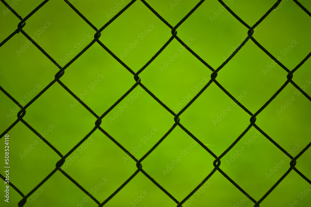 metal mesh,in the photo a mesh on a green background metal mesh,in the photo a mesh on a green background