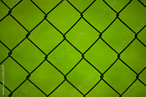 metal mesh,in the photo a mesh on a green background