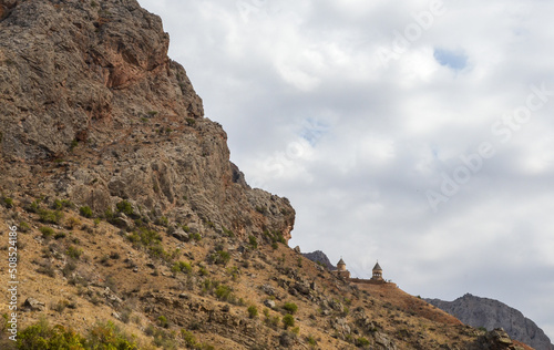 Picturesque view of the Noravank monastery complex located on a rock on the ledge of a narrow winding gorge of the Amaghu River © Dmytro