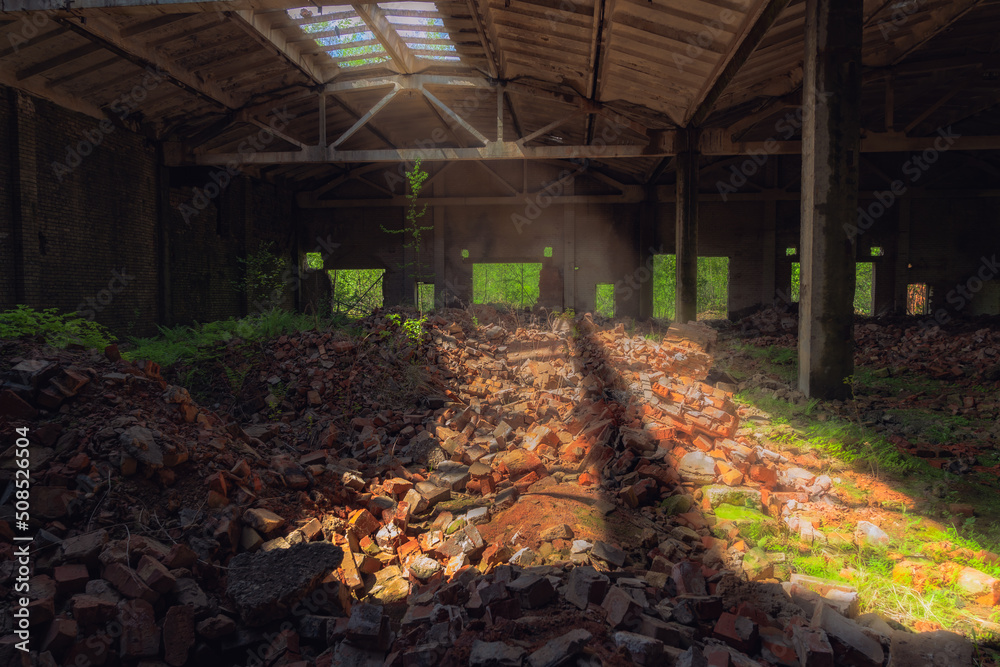 Sunlight shines from roof in an abandoned factory Sunlight shines from roof in an abandoned factory