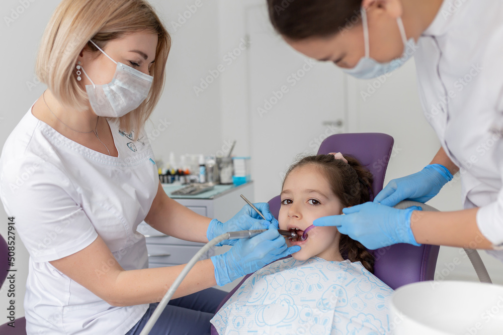Child to the dentist. Child in the dental chair