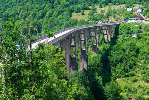Concrete arch Durdevica Tara Bridge over Tara Canyon River in northern Montenegro.