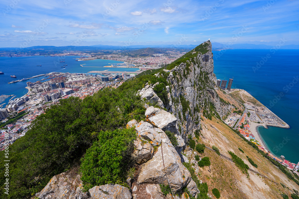 View of the rock of Gibraltar from its top - Vertical cliffs over the city center of this Overseas Territory of the United Kingdom in the South of Spain by the Mediterranean Sea