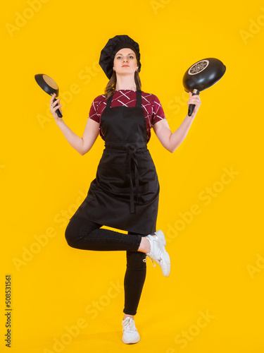 Cook woman. Girl cook stand...