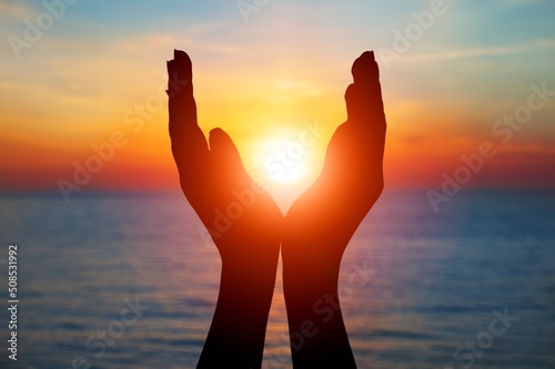 Human hands open palm up worship. Christian Religion concept background.