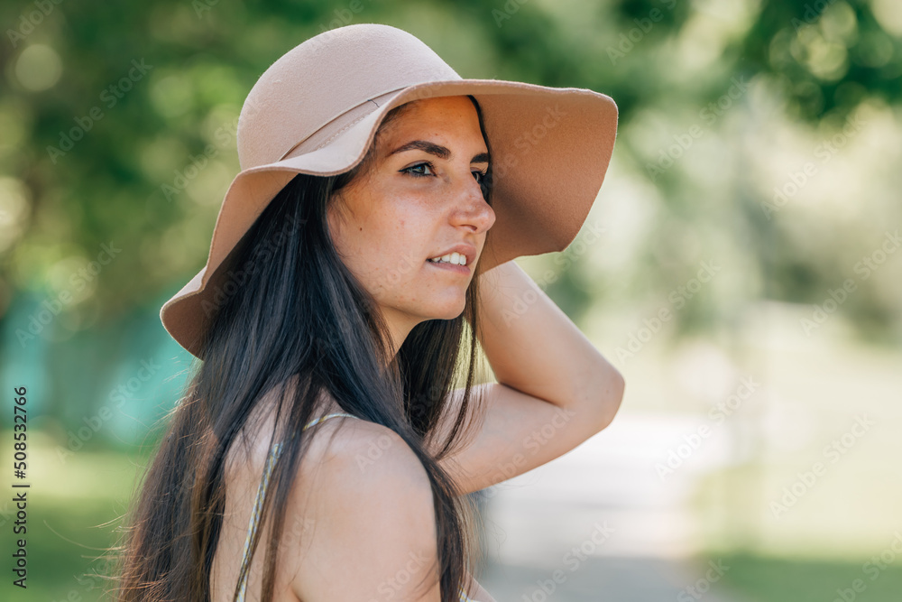 girl with hat in summer outdoors