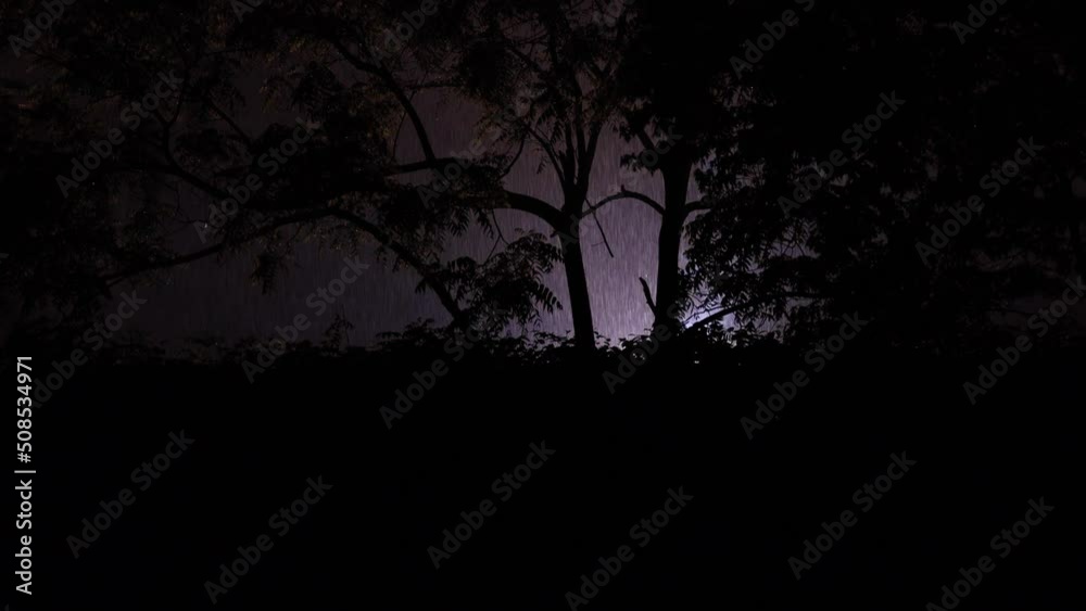 Bright flashing lights of exploded transformer burning on a cold wet evening during a thunder lightening storm downpour Bright flashing lights of exploded transformer burning on a cold wet evening during a thunder lightening storm downpour