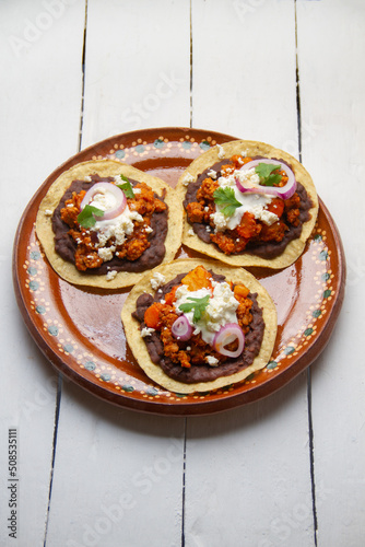 picadillo corn tostadas with cheese and beans. Mexican food