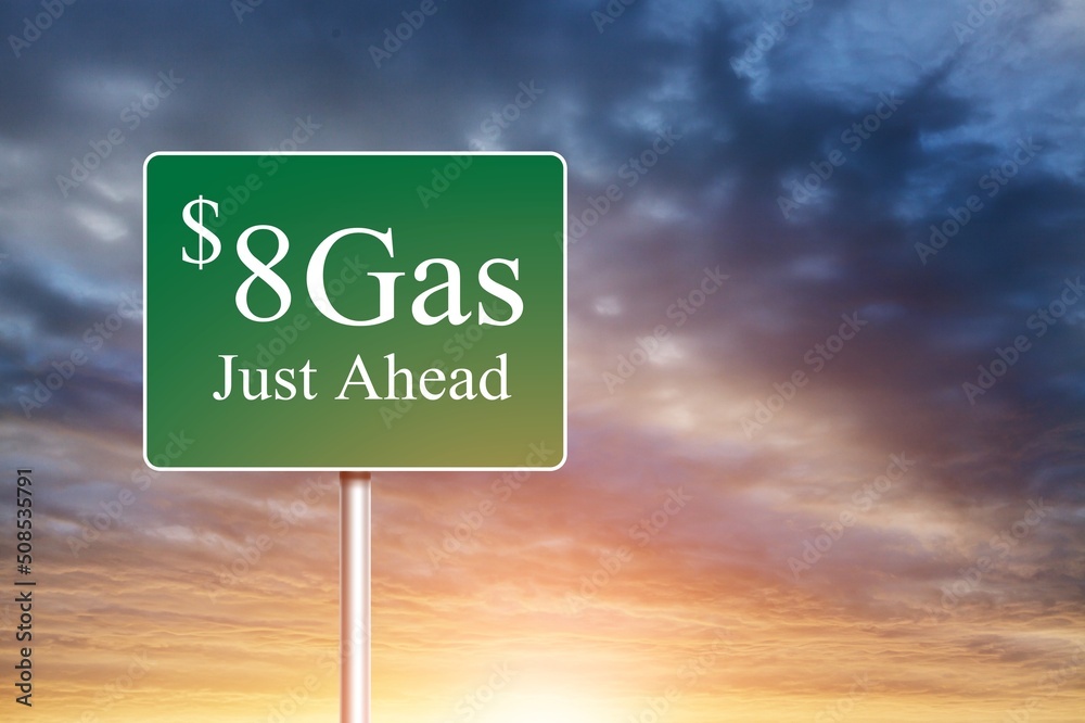 Obraz premium $8 Gas Green letter on Road Sign Against Cloudy Sky.