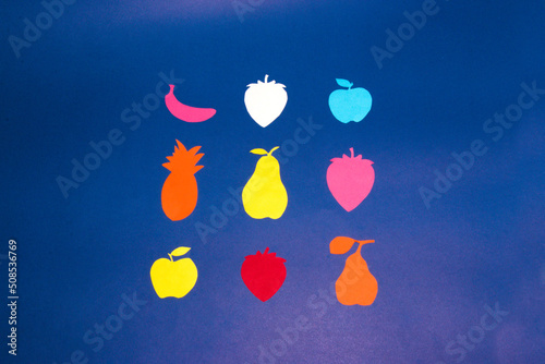 Fototapeta Naklejka Na Ścianę i Meble -  fruit on a blue background, colorful paper fruit, creative healthy design, vitamins