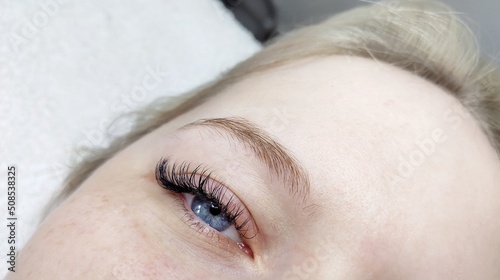 Eyelash extensions in beauty salon macro eye  photo