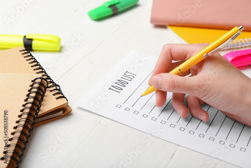 Woman making to-do list on ...