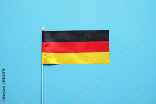 National flag of Germany on blue background