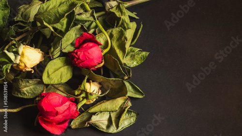 Bouquet of red and yellow flowers with dried leaves. Wedding and party concept